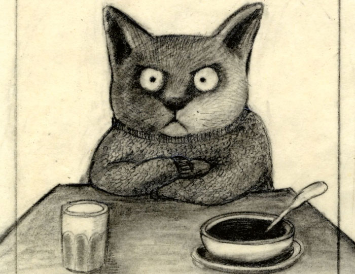 Katze am Esstisch